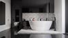 Czarno-biała łazienka z patchworkiem i wanną wolnostojącą