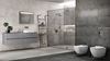 Szara łazienka w płytach o wyglądzie betonu z kolekcji Cersanit Divena
