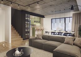 Szary salon z betonowym, industrialnym sufitem