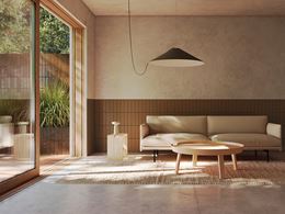 Minimalistyczny salon w beżowym wykończeniu z wyjściem na taras