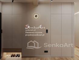 Szary, długi przedpokój z szarymi szafami z wnęka na buty