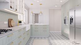 Miętowa zabudowa meblowa w kuchni z patchworkiem na podłodze