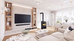 Przestronny salon z kominkiem typu koza 