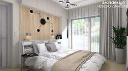Sypialnia w drewnie z białą zabudową