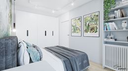 Jasnoniebieska sypialnia z białą szafą