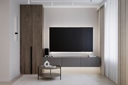 Salon z fornirowaną szafą i frezowaną dekoracją za telewizorem