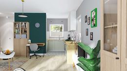Salon z miejscem do pracy na tle zielonej ściany
