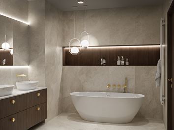 Wanna wolnostojąca w beżowej, eleganckiej łazience
