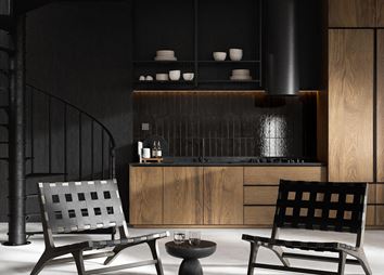 Czarny aneks kuchenny z brązową zabudową