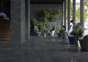 Zieleń i grafitowy kamień w aranżacji przestrzeni hotelowej