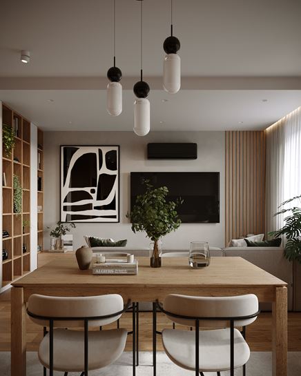 Jasna jadalnia z drewnianym stołem za sofą w salonie