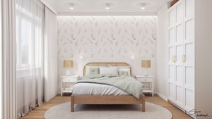 Jasna sypialnia z wzorzystą tapetą