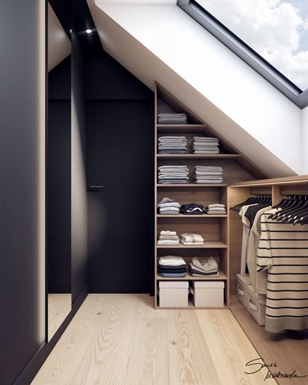 Mała garderoba na poddaszu z czarną ścianą