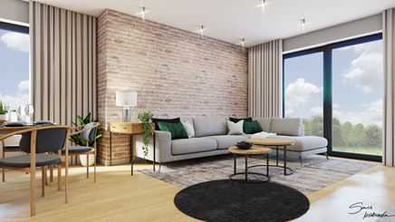 Jasny salon z czerwoną cegłą na ścianie