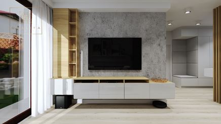 Betonowa ścianka telewizyjna z elegancką, drewniano-białą zabudową