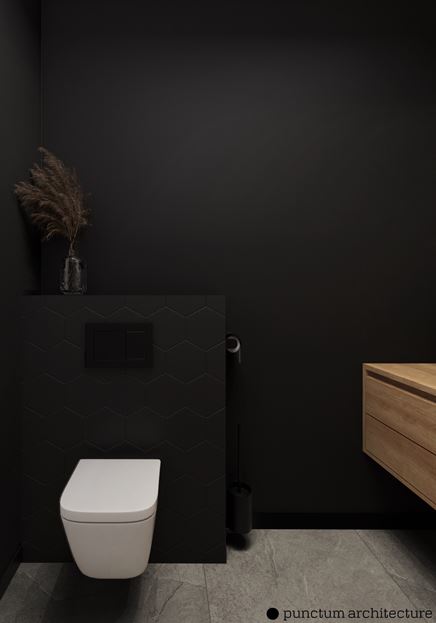 Czarna toaleta z heksagonami na zabudowie stelaża