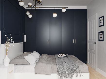 Mała sypialnia z ciemna zabudową