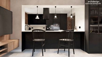 Czarna kuchnia z barem śniadaniowym