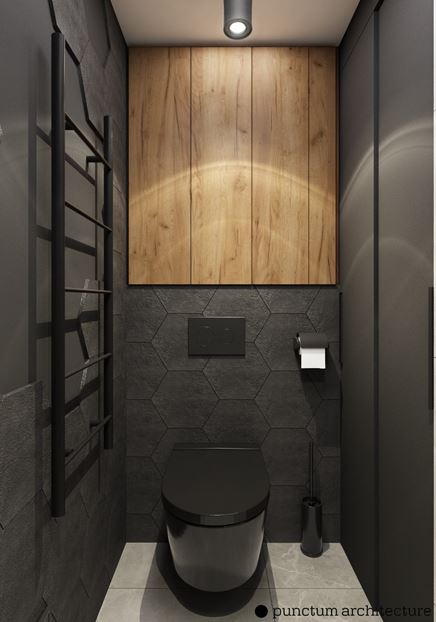 Toaleta w czarnych kaflach o kształcie plastra miodu