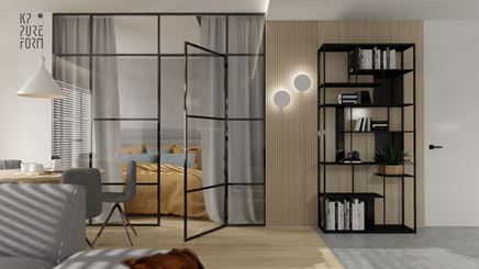 Szklana ścianka w salonie z czarnymi szprosami