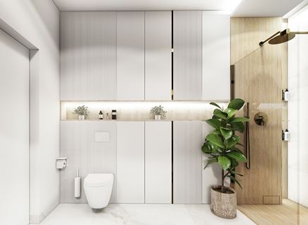 Prysznic z drewnianymi strukturami i białe szafki w łazience