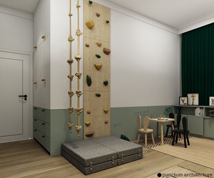 Szafa, plac zabaw oraz stoliczek do rysowania w biało-zielonym pokoju