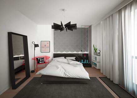 Sypialnia z tapetą w trójkąty i czarnymi akcentami