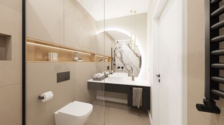 Asymetryczne lustro nad umywalką w beżowej łazience