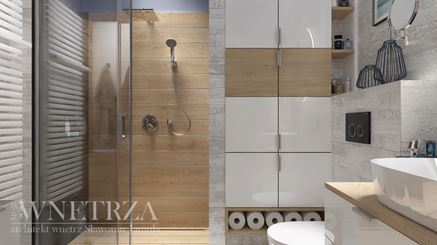 Łazienka z drewnopodobnymi płytkami pod prysznicem