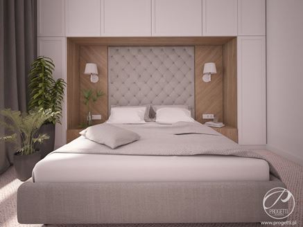 Ściana za łóżkiem z praktyczną zabudową meblową
