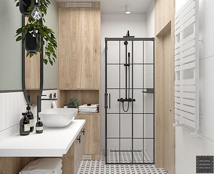 Prysznic z czarnymi szprosami w biało-zielonej łazience