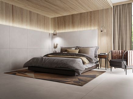 Betonowe płyty Cerrad Modern Concrete w wykończeniu sypialni z drewnem