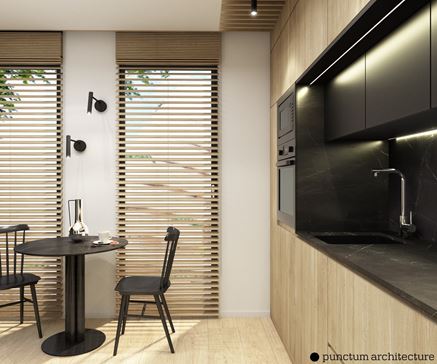 Drewno i czarny marmur w aranżacji nowoczesnej kuchni