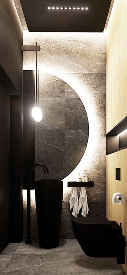 Czarna toaleta z asymetrycznym lustrem i wolnostojącą umywalką