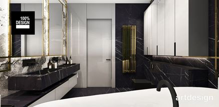 Marmurowe umywalki i złoty grzejnik w salonie kąpielowym glamour