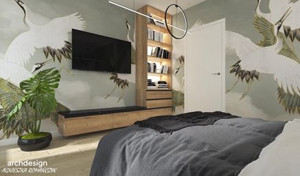 Sypialnia z zieloną tapetą z motywem ptaków