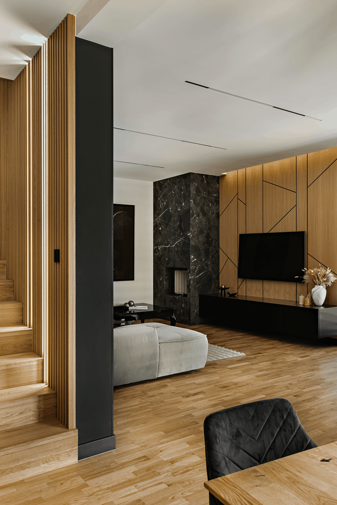 Salon z czarnym kamieniem i drewnem, projekt AVO Architects