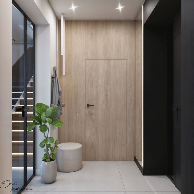 Czerń i drewno w nowoczesnym wiatrołapie