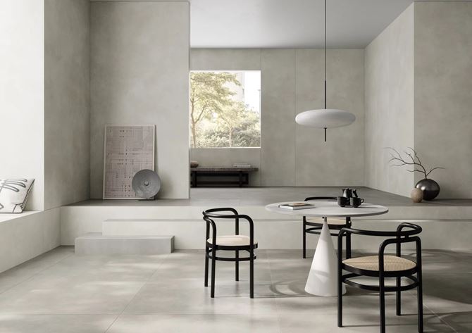 Przestronna jadalnia w jasnoszarym betonie