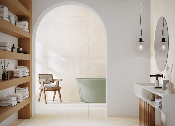 Jasna łazienka w kamieniu z zieloną wanną