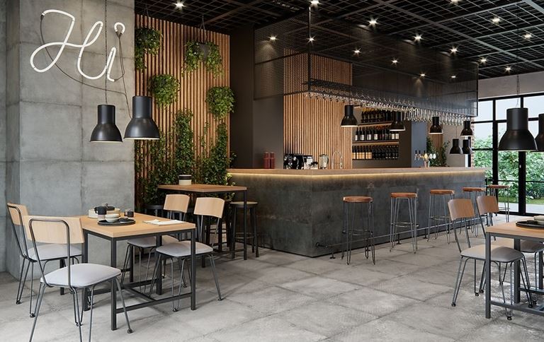 Wnętrze restauracji wykończone betonowymi płytami i drewnem