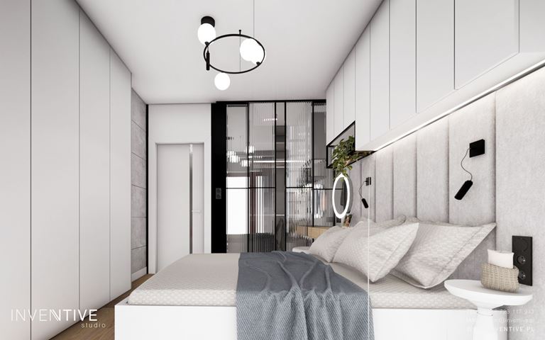 Biała sypialnia z szafą i półkami wiszącymi nad łóżkiem