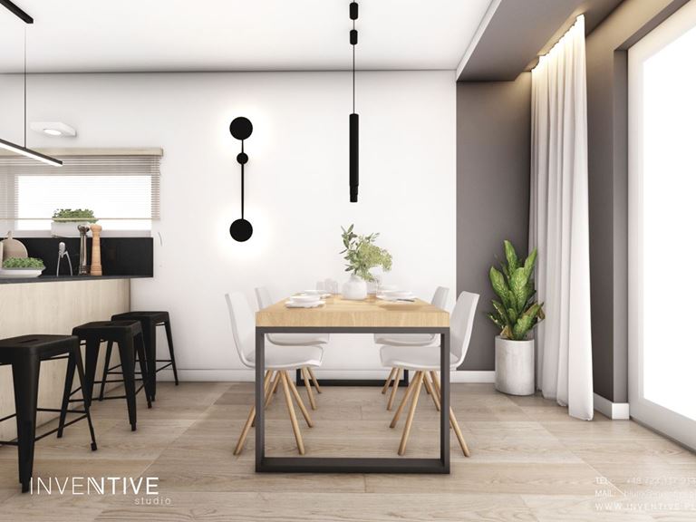 Jasna jadalnia z industrialnym stołem