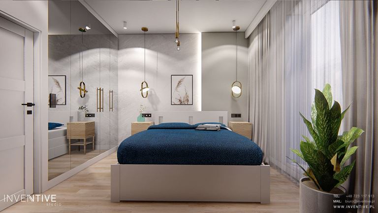 Sypialnia z asymetryczną ścianą z kamieniem i podświetleniem