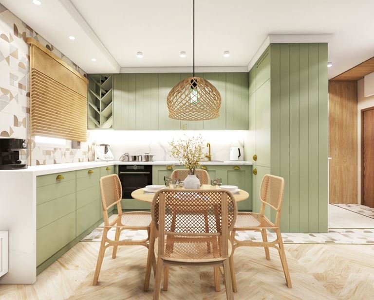 Jadalnia z drewnianym stołem w zielonej kuchni