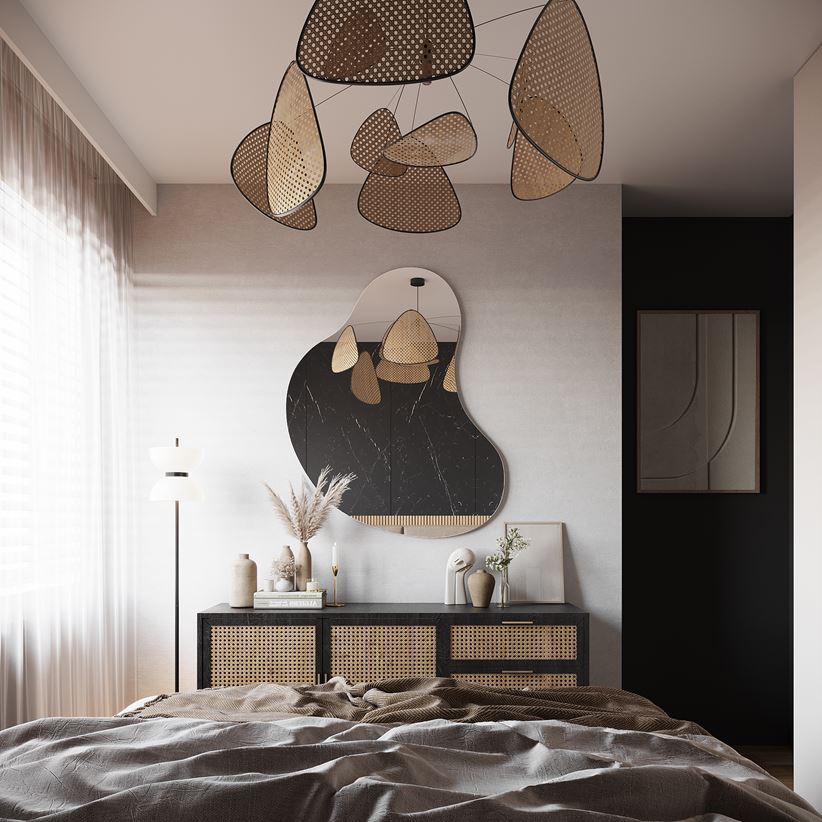 Biało-czarna sypialnia z rattanowymi akcentami