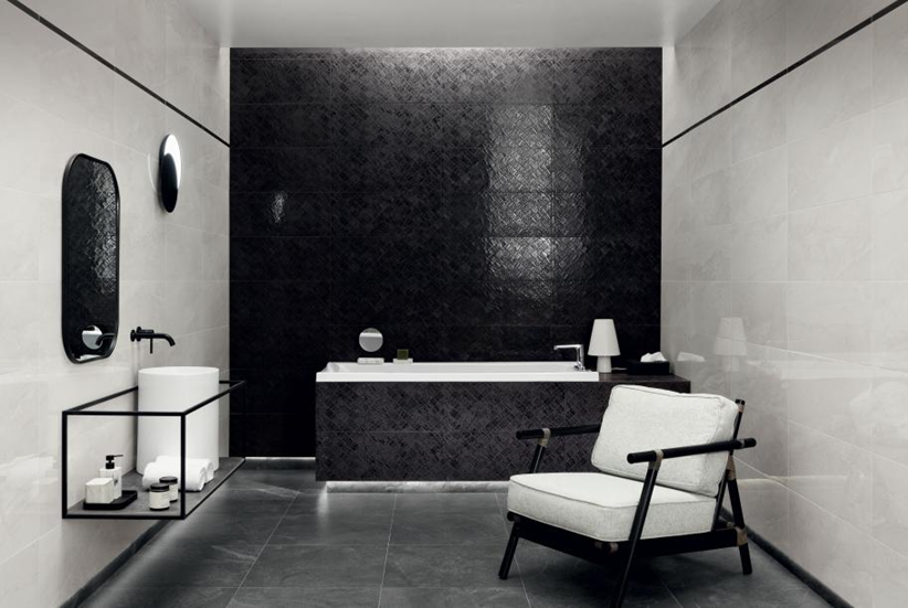 Czarno-biała łazienka wykończona płytkami z motywem kamieni