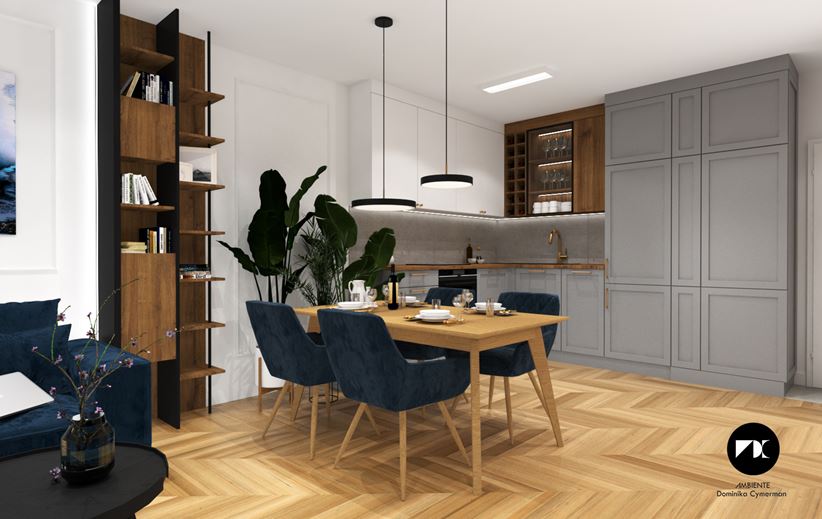 Szary aneks z ramowanymi frontami i drewnianym stołem jadalnym