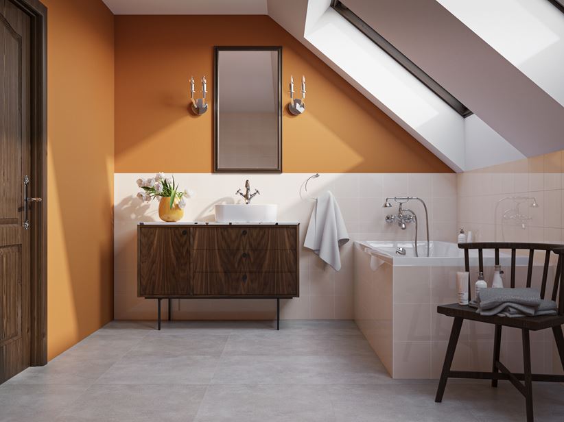 Beżowo-pomarańczowa łazienka z szarą podłogą