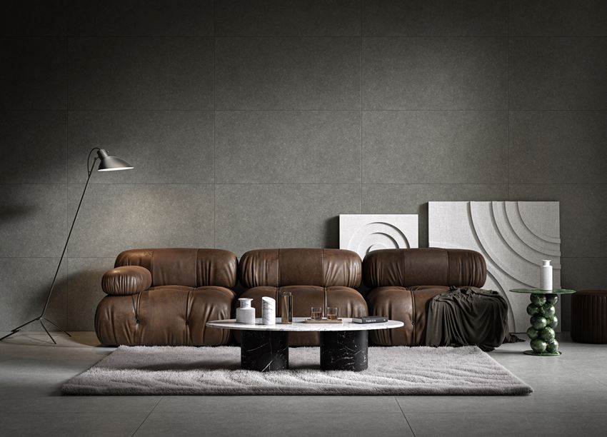 Salon w szarym kamieniu ze skórzaną sofą